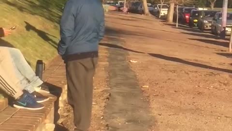 Man in grey roller blades into brick wall