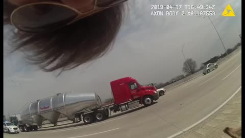 Officer corrals donkey in the middle of an interstate