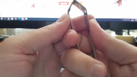 Unpacking fish bones pincer from Aliexpress.