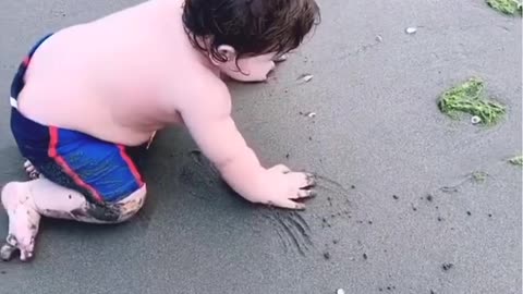 Cute Boy Enjoying and Playing on Beach