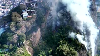 Drone video shows massive forest fire raging near Rio favela