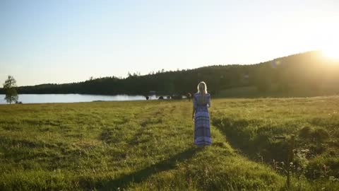 Little girl plays music for cows