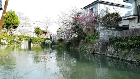 A tour of a Japanese wooden boat around a village