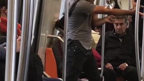 Guy on subway dancing with magic glass ball