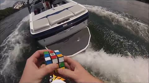 Solving a Rubik's Cube while wake surfing