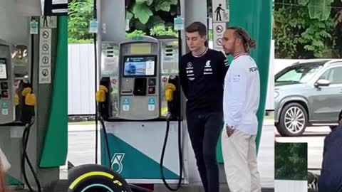 F1 drivers Hamilton & Russell spotted at KL petrol station on 11 Apr