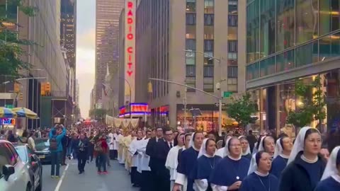 More than 5,000 Catholics walked down the streets of New York City praying and singing for peace.