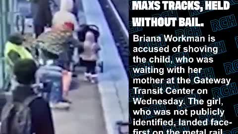 Woman shoving child onto maxs tracks