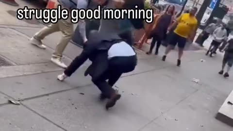 Suited up guy swings at homeless man and immediately regrets it.