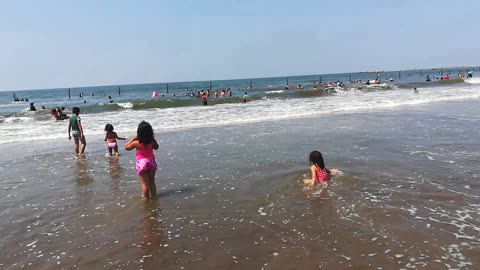 Girls Play On Ras El Bar Beach Blue Water