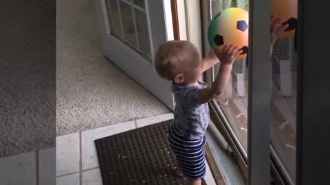 Baby and bouncing ball funny video.