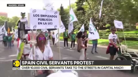 Over 10,000 civil servants take to streets in Spain over wage rise | Latest News | WION