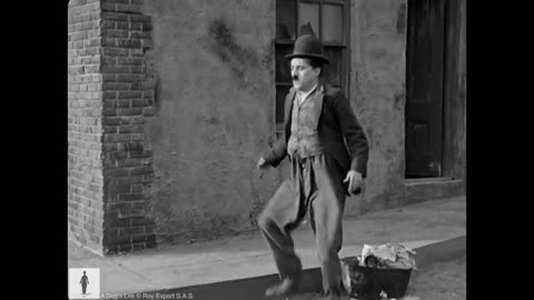 Charlie Chaplin saves Scraps from a wild pack of dogs - From "A Dog's Life"