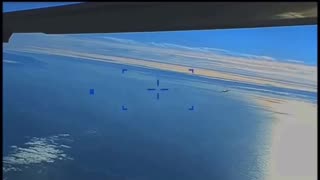 Russian Su-27 aircraft dumping fuel on the American MQ-9 drone