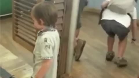 kid gets smashed by spring loaded gate.