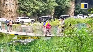 Woman repeatedly shakes bridge in China