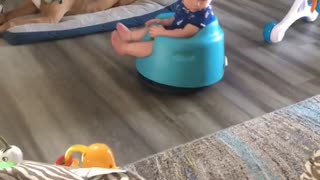 Baby Enjoys Ride on Roomba Vacuum