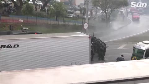 Brazilian police fire water cannons and rubber bullets at anti Lula protesters