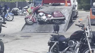 Tow Truck Drags Motorcycle Up Ramp