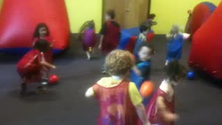 Toddlers playing ball tag