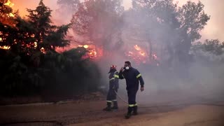 Wildfires swallow homes in northern Athens suburbs