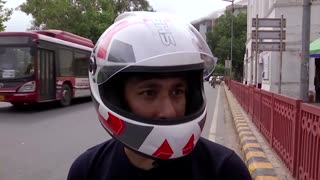 'Fresh air' with anti-pollution helmet in India