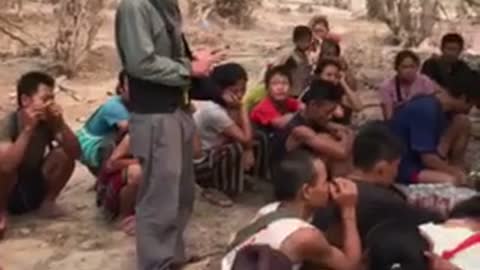 A Sqaw Karen Pastor Preaches to Karen Refuges Before a Bible Distribution