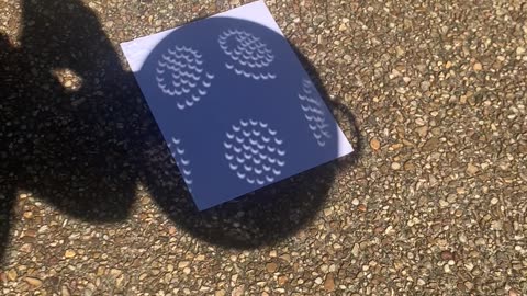 Eclipse And Pinhole Effect Create Crescent-Shaped Shadows