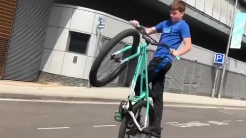Boy showing his best skill while cycling