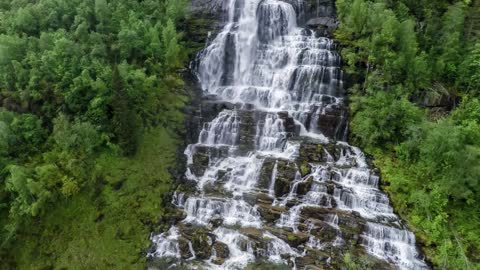 aerial footage from tvindefossen waterfall from the birds eye view norway