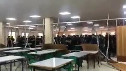 Iranian university students tear down wall separating men and women in dining hall