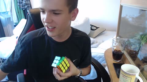 OXSN solves Rubik's cube in 27 seconds while rapping spencer noble diss track by OXSN