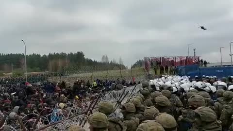 A Large groups of illegal migrants gather at Poland-Belarus border crossing.