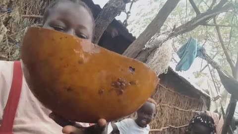 COOKING FOOD IN SOUTH SUDAN VILLAGE