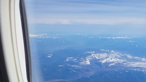 From the airplane window mounts st Helens Adams and rainier