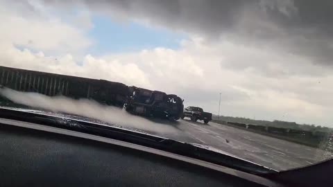 Tornado in Nebraska flips a 18 Wheeler on it's side!