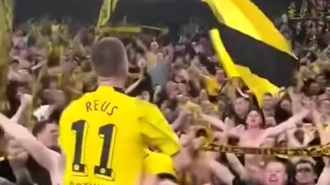 Marco Reus celebrates with the Dortmund fans after the win against PSG