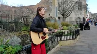 Ben Westwood Busking a song in Glastonbury