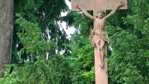 Jesus statue in the garden of a cemetery