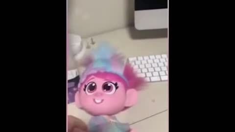 SHOCKING! A Trolls doll has a hidden button that does what?