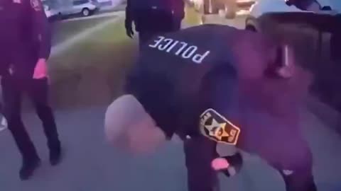 Handcuffed suspect violanty assaulted by cops while other cops watch.