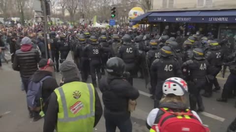 French police stand off with anti-pension reform protestors in Paris