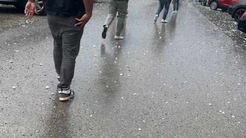 Hailstorm Aftermath In a Packed Parking Lot