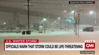 Woman tries to walk in deep snow after massive storm hits New York