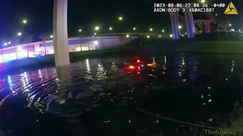 Orlando, Florida police officers save driver trapped in a car as it submerges in pond