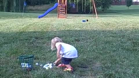 2 year old smacks golf ball & dog retrieves ball