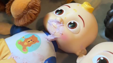 Toddler Tries to Feed Dolls Yogurt