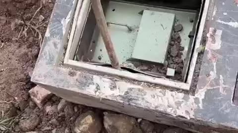 Steel safe box buried in ground