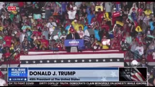 President Trump continues on his speech during a rain shower at the Save America rally in Miami, FL