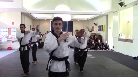 Cody leads the black belts in their pattern. June grading